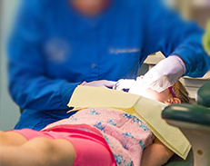 Doctor Working on a Patient at her office in Chicago, IL