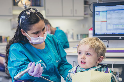Child getting teeth cleaned - Pediatric Dentist serving Streeterville, IL