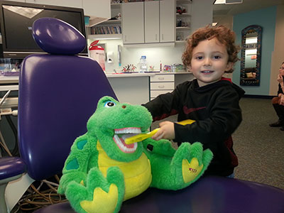 Patient with mascot - Pediatric Dentist serving Hyde Park, IL